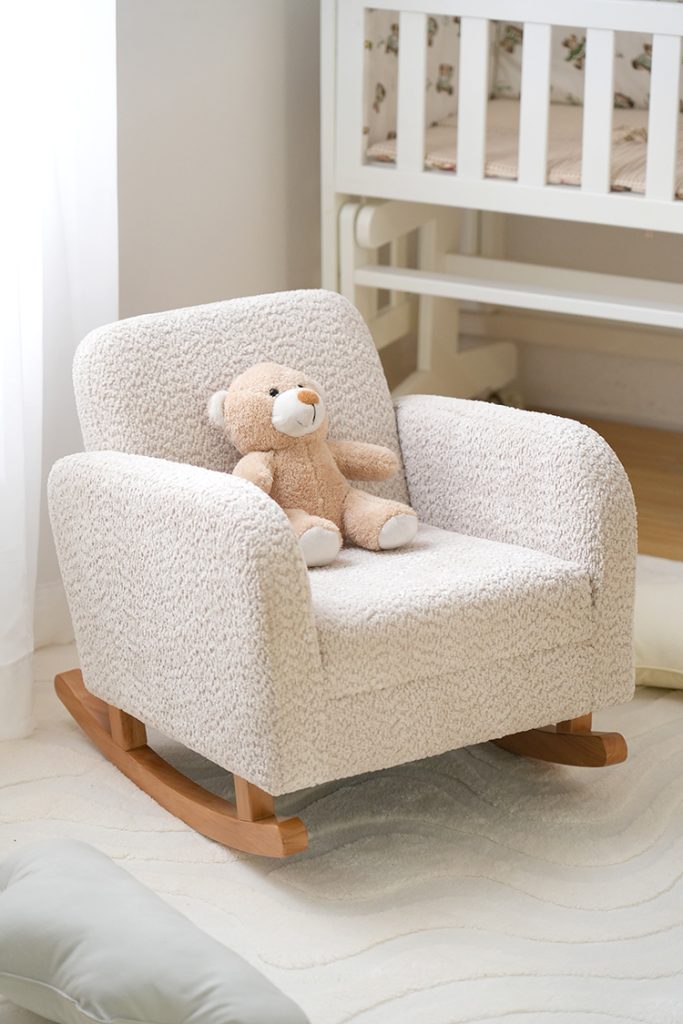 Cream upholstered Kids Sofa Rocking Chair with wide padded armrests and curved wooden rockers