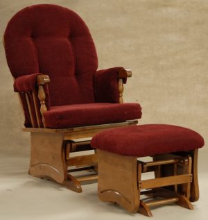 Red upholstered wooden nursery glider chair with matching ottoman