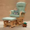 Light green nursery glider chair with natural wooden frame and ottoman