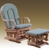 Warm Wood Nursery Glider Chair Traditional wooden nursery glider chair with neutral cushions and gliding ottoman