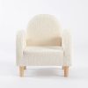 Cream Upholstered Kids Armchair – Front View Cream upholstered kids armchair with rounded backrest, padded arms and wooden legs