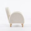 Cream Kids Armchair – Side View Side view of cream kids armchair showing rounded upholstered armrest and wooden legs