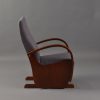 Side view of wooden nursery glider chair with high upholstered back