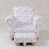 Floral Kids Sofa with Tuck-Away Ottoman – Front View Front view of floral kids sofa with tuck-away ottoman and padded rolled arms