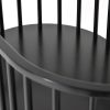 Wooden baby bassinet with oval sleeping area, vertical rails and black finish