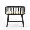 Black baby bassinet with oval wooden frame and raised four-leg stand, front view