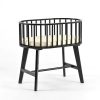 Baby bassinet with mattress featuring black wooden rails and elevated stand