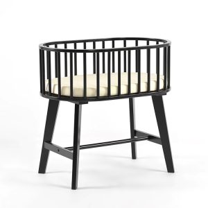 Baby bassinet with mattress featuring black wooden rails and elevated stand