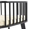 Newborn baby bassinet with cream mattress, oval wooden frame and black stand