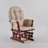 Dark Wood Nursery Glider Chair Dark wood nursery glider chair with beige padded tufted backrest