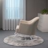 Modern Beige Nursery Rocker - Side View Side view of beige nursery rocking chair with curved wooden rocker base