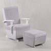 Light gray high back nursery glider chair with white frame and ottoman