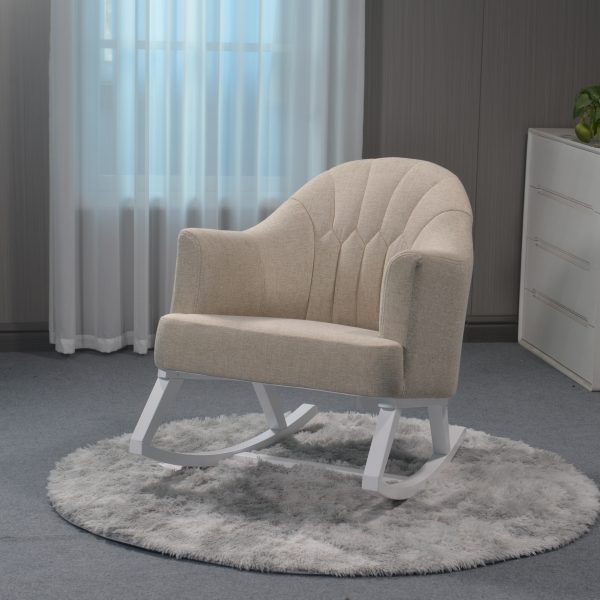 Beige Upholstered Nursery Rocking Chair Beige upholstered nursery rocking chair with white wooden base in modern interior