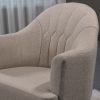 Nursery Rocking Chair Upholstery Detail Close-up of channel-stitched backrest and padded armrest on nursery rocking chair