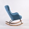 Side view of blue wingback nursery rocking chair with wood and metal base