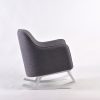 Gray Modern Nursery Rocking Chair Gray upholstered nursery rocking chair with curved white wooden rockers