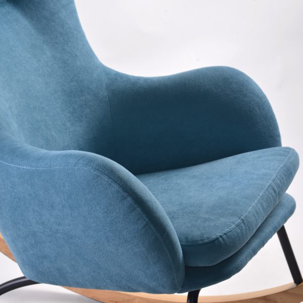 Close-up of blue wingback nursery rocking chair back upholstery
