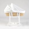 Side view of woven baby bassinet with white canopy and wooden rocking stand