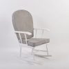 White wooden nursery rocking chair with light gray padded cushions