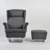 Wingback nursery glider with ottoman in gray upholstery and white base