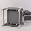 modern nursery chair with upholstered fabric and wooden armrest