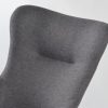 Gray upholstered wingback nursery rocking chair angled view