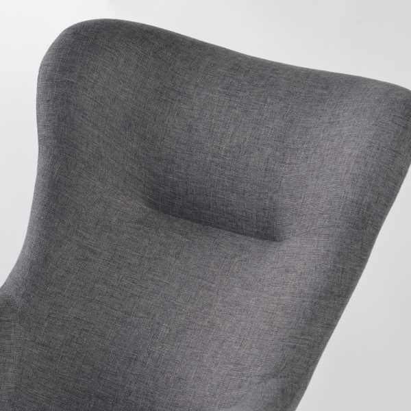 Gray upholstered wingback nursery rocking chair angled view