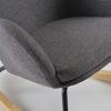 Close-up of gray wingback nursery rocking chair padded seat