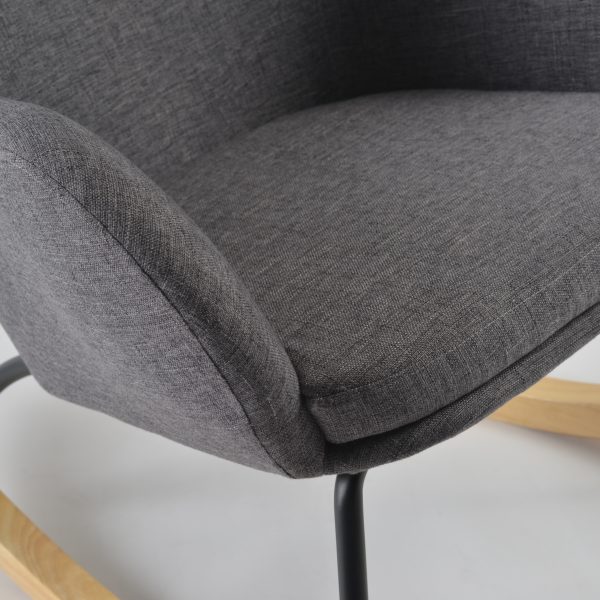 Close-up of gray wingback nursery rocking chair padded seat