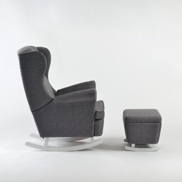 Side view of wingback nursery glider with ottoman and white rocker base