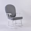 White wooden nursery rocking chair with gray upholstered cushions