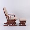 Side view of wooden nursery glider chair with matching gliding ottoman