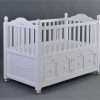 White Storage Baby Crib Side View Side view of large white baby crib with integrated storage