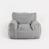 Soft Kids Bean Bag Chair – Front View Front view of grey Kids Bean Bag Chair with padded armrests, cushioned seat and white piping