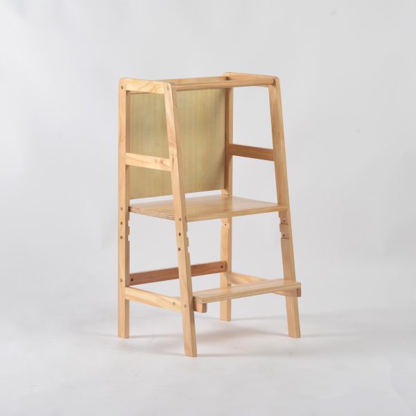 Back view of wooden toddler learning tower with chalkboard panel
