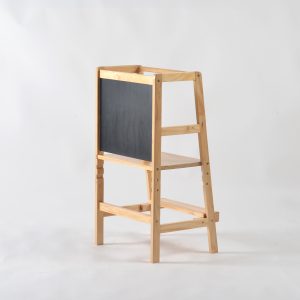 Wooden toddler learning tower with chalkboard drawing surface