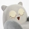 Close-up of owl kids sofa showing embroidered eyes, beak and soft backrest