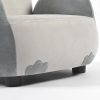 Close-up of upholstered kids sofa showing padded seat, decorative owl feet and low furniture legs
