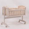 End view of wooden baby rocking cradle with caster wheels