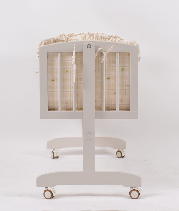 Side view of wooden baby rocking cradle with suspended cradle body