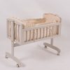 Wooden baby rocking cradle with slatted sides and wheeled base