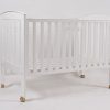 White mobile wooden baby crib with caster wheels