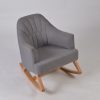 Upholstered nursery rocking chair with gray channel tufted back and wood base