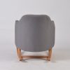 Back view of gray upholstered nursery rocking chair