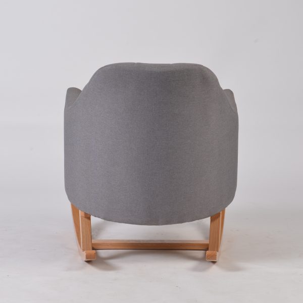 Back view of gray upholstered nursery rocking chair