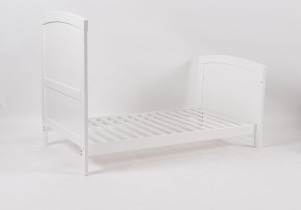 White Convertible Baby Crib to Toddler Bed White wooden convertible baby crib transformed into a toddler bed