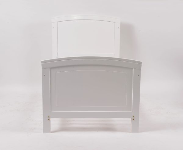 Convertible Crib Curved Footboard Curved footboard of white convertible baby crib and toddler bed