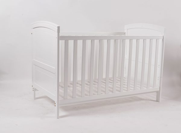 White Convertible Baby Crib Angled view of white convertible baby crib with slatted side panels