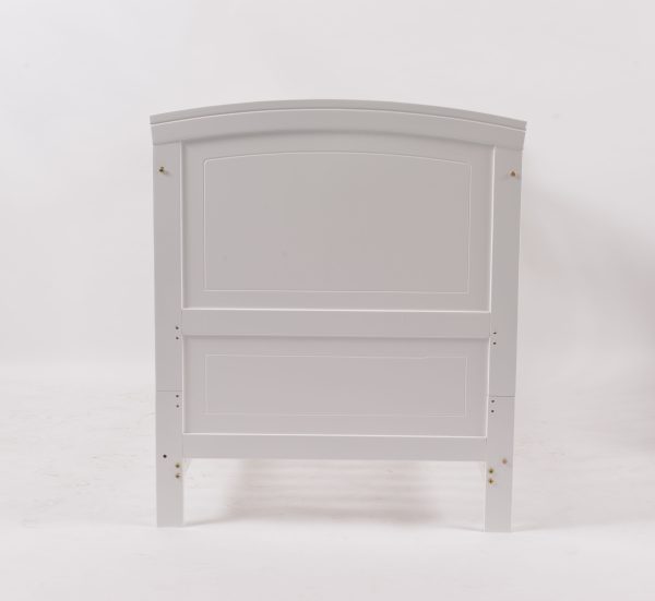 Convertible Wooden Baby Crib Front View Front view of white wooden convertible baby crib with slatted side