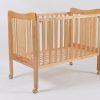 Wooden Baby Crib with Wheels Natural wooden baby crib with slatted sides and caster wheels
